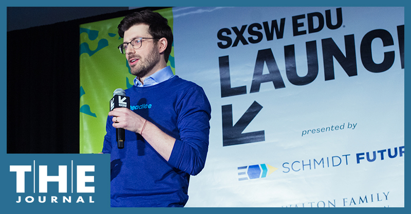 photo from SXSW EDU 2022 man holding microphone on stage with banner in background saying SXSW EDU LAUNCH