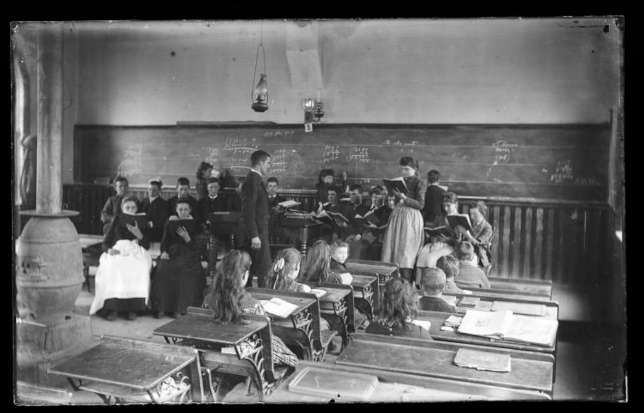 Positive image from a glass plate negative by Walter J. Hussey, Schoolclassroom. Source: Smithsonian Open Access